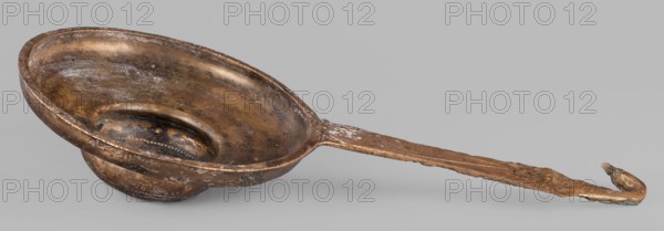 Strainer with a handle in the form of a swan's head;, swans iconography; tools. Wide, flattened container with a hemispherical strainer and a flat handle ending in a bird's head. 2nd half of the 4th century BC previously dated 4th century BC. Etruria. Vessel. Height 23.1 cm, width 11.3 cm, depth 4 cm, weight 0.14 kg., An aged metal ladle with a wide shallow bowl and a long flat handle; the surface shows a worn, uneven texture with patches of darker and lighter browns and areas of greenish corrosion; the bowl interior has mottled brown and dark gray tones with some lighter brown highlights and small speckled blemishes, while the underside and rim show a mix of brown and darker bronze shades; the handle is narrow and elongated with an irregular, slightly twisted profile and a curled end, displaying brown and bronze hues with traces of green patina and darker spots; the background is a smooth pale gray.