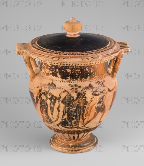 Column krater with lid, unknown Attic workshop. Black-figure krater with lid. Red clay, tinted with ochre. Black firnis with a muted lustre, fading to brown in places. The rim of the vessel is decorated with a radial ornament and a schematic ivy sprig. On the shoulders are a series of vertical lines. The belly is decorated with figural scenes. On side A, Dionysus with a cornucopia is shown, accompanied by a satyr and a maenad. On side B an archer is depicted between two helmeted hoplites with round shields. A lid with a pomegranate-shaped handle, decorated with an ivy sprig on the rim. 520–510 BC, Attica. Vessel column krater. Weight 1.382 kg; diameter 19.2 cm 22.5 cm with vices; height 21.4 cm 22.6 cm with vices., An earthenware vessel with a lid and a knobbed finial sits against a plain light gray background; the vessel is primarily terracotta with worn black painted areas forming decorative bands and figural shapes, and there are also areas of faded reddish and brown hues, a pair of...
