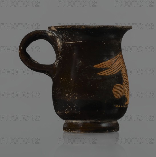 Jug, red-figure pottery, Greek, mermaid mythological, Athens Attica, 3rd quarter of the 5th century BC. A small jug with a low foot recessed at the bottom; edges of the foot slightly rounded and tapered upwards. Body slightly wider than the foot, rounded at the bottom, almost cylindrical in the lower half and gently tapering in the upper half, merging into a widely flared outward spout. Below the spout is a vertically mounted, cylindrical, slightly flattened handle bent into a circle. Light orange clay with black shiny varnish. On the body a mermaid in right profile with wings raised upwards left wing behind, protruding above the right; on her head a diadem marked with white dots. Feathers indicated by lines—long and thin at wingtips and tail; thin and thick elsewhere. Image emphasized below with a row of dots. Side of the foot chipped, rim edge slightly chipped, varnish abrasion; part of the rim filled with plaster. Vessel height 6.6 cm., A dark brown ceramic cup with a rounded body, ...