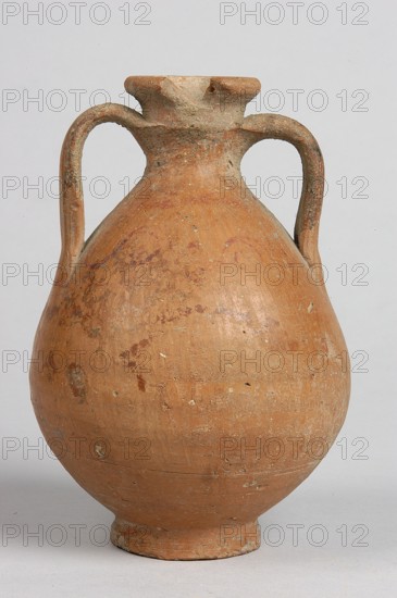 Pelike, Decoration painted on the firnis: between the handles on both sides, a wavy linear tendril with volute-like curled side shoots. Above it, a wavy line twist?. At the height of the base of the handles, two horizontal parallel lines. 332–30 BC; Hellenistic period, vessel, height 12.5 cm, width 9.8 cm, A large rounded clay vessel with a narrow neck and a flared rim, featuring a pair of curved handles attaching near the neck and shoulder; the surface shows worn and uneven texture with patches and speckles. The vessel is mainly terracotta brown with areas of darker brown and muted reddish-brown, along with small pale gray and off-white spots and encrustations. The background is a plain light gray.