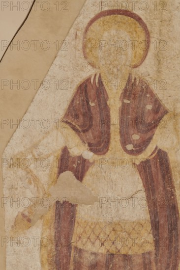 Wall painting: High Priest Aaron, Nubian workshop, wall painting, censer iconographic, liturgical vestments, Faras Sudan, Old Testament high priest iconographic, arms spread to the sides, in his right hand the priest holds a censer in the shape of a hemispherical cup on a foot suspended on three long chains, in his left hand a leafy branch and a box . A yellow nimbus outlined with a red line around the figure's head. The face is heavily blurred, features invisible. The ankle-length white tunic is decorated with a diagonal red check pattern at thigh level, followed by a light purple stripe with vertical dark purple stripes, a diagonal checkered belt, and then another vertical stripe pattern. The high priest's shoulders are covered by a light purple belt with darker purple vertical stripes, fastened at the chest with an oval clasp. On his feet, the figure wears dark purple slippers. Original plaster: 224 x 147 cm, 1st quarter of the 10th century, Faras, wall painting, height 253 cm, widt...