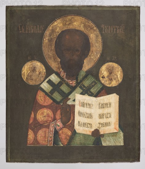 Icon: St. Nicholas the Wonderworker, Russian workshop; Nicholas of Myra ca. 270–352, bishops, Mary mother of Jesus, Jesus Christ; book, omophorion, maphorion, halo, inscriptions. The icon depicts the bust of Saint Nicholas dressed in bishop's robes. In his left hand he holds an open Gospel; his right hand is raised in blessing. On either side are medallions with busts of Christ holding a book and the Mother of God with an omophorion. The work is schematic with a simplified color scheme; the saint's face is ascetic, dark-toned and deeply wrinkled. 19th century, Russia; icon; height 31.0 cm, width 26.5 cm., A painted icon of a bearded figure shown from the waist up, wearing layered robes with patterned circular medallions in red and gold and a green and blue-striped outer garment, holding an open book with visible pages, and making a gesture with one hand; the figure has a large gold halo with worn areas and a dark brown face and hair; two smaller round gold medallions flank the head sho...