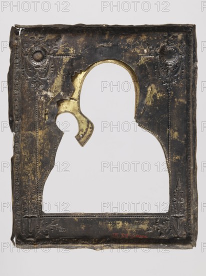 Icon in a cover: Our Lady of Tikhvin, Russian workshop, I.Ch., Mary mother of Jesus Christ, Our Lady of Tikhvin iconography, icons, Jesus Christ, icon covers, Our Lady and Child iconography, maphorion iconography, scrolls, ornaments. Canonical variant of the image of Our Lady of Tikhvin — colors predominating in green, vermilion, and ochre. The icon was most likely heavily repainted in the 2nd half of the 20th century. It has a cover consisting of a basma, background, and wreaths — brass repoussé, with very rich ornamentation, especially in the corners motif of candelabra, medallions with garlands. The frame is covered with an engraved floral and plant pattern; the applied haloes are surrounded by radially arranged leaves. 19th century, Russia. Height 31.3 cm, width 24.2 cm., A rectangular metal frame with an ornate embossed border and a central silhouette-shaped cutout; the frame shows worn and peeled areas revealing shiny metallic patches beneath a darker surface, with decorative flo...