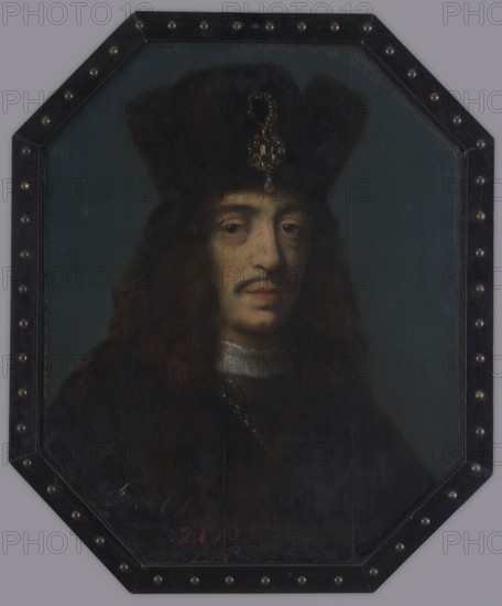 John II Casimir Vasa 1609–1672, attributed to Daniel Schultz ca. 1615–1683. Oil on oak panel, portrait, height 62.0 cm, width 50.0 cm; mid- to late 17th century. Likely created as a coffin portrait to decorate the castrum doloris for John Casimir’s 1673 service in the collegiate church of St. John in Warsaw. The painting displays features characteristic of Schultz: the king’s face with the same physiognomic type as in other Schultz portraits, grayish modeling achieved with impasto, visible in X-ray and infrared images. The youthful, slim depiction led some to date it to the mid-1640s, but dendrochronology indicates the panel comes from an oak felled no earlier than 1660, supporting a later date. The portrait unusually combines a Western wig with a fur cap part of Polish costume. The series includes other panel portraits e.g., of Elizabeth, wife of Casimir IV Jagiellon, and Elizabeth, wife of Sigismund II Augustus. Inscriptions on the painting: on the face “Joa... Ca...”; at the lower l...