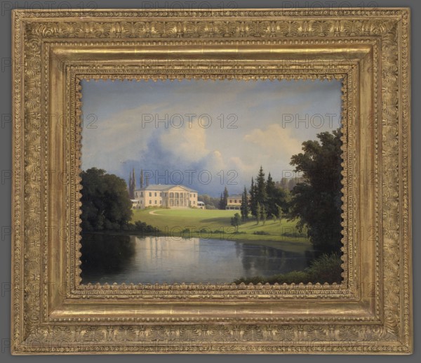 Palace in Szpanów, Peyer, Heinrich fl. 1844–1862 painter, Radziwill, palace Nieborów, after 1852, painting, height 32.5 cm, width 40.0 cm, A framed painting showing a landscape with a large classical white building on a green lawn beside a reflective body of water, surrounded by groups of trees and shrubs. The sky above is pale blue with soft white and gray clouds. Trees in the scene are various shades of green and dark green, with some brown trunks visible. The water reflects the sky and surrounding greenery in muted blues and greens. The painting is set in an ornate gold frame with textured decorative patterns and a warm metallic gold color.