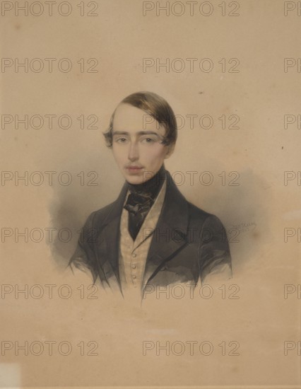 Karol Andrzej Radziwill 1821–1886, painted by Waldemar Hau 1816–1895. Bust slightly turned to the left, head straight. Light hair, combed smoothly with a parting, blue eyes. Dressed in a black coat with a straw-colored checked vest; a black cravat around the neck. The miniature is framed in a frame covered with navy blue velvet with a wavy rim and a narrow brown rocaille strip around the perimeter. On the frame at the top there is a brown shield with an enamel Radziwill coat of arms — the Black Eagle with trumpets, topped with an enamel mitre. 1843, St. Petersburg. Portrait. Image: 23.5 × 19.5 cm; Frame: 36.5 × 32.5 cm., A portrait of a young man shown from the chest up wearing dark brown hair styled with a side part, pale skin, and a neutral expression; he has light-colored eyes and a narrow mustache. He is dressed in a dark black coat with broad lapels over a light beige vest and a dark neckcloth. The background is a warm beige with subtle grayish shadows around the figure, and the o...