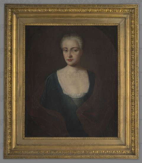 Portrait of Elzbieta Sieniawska/Aleksandra Oginska, née Czartoryska?, unknown author. Half-length, facing the viewer. She wears a light wig with her hair combed back, a blue dress with a large lace-trimmed neckline, and a red coat over her shoulders. Dark, plain background. 18th century, Poland. Portrait; height 76 cm, width 62 cm., A painted portrait of a woman shown from the torso up, set inside an ornate gold frame; the woman has pale skin and light hair pulled back, with a neutral facial expression and visible eyes and lips; she wears a dark blue dress with a low neckline edged in white lace and a dark shawl draped around her shoulders; the background behind her is dark brown to almost black, and the frame has multiple decorative gold layers with carved patterns and beaded trim.