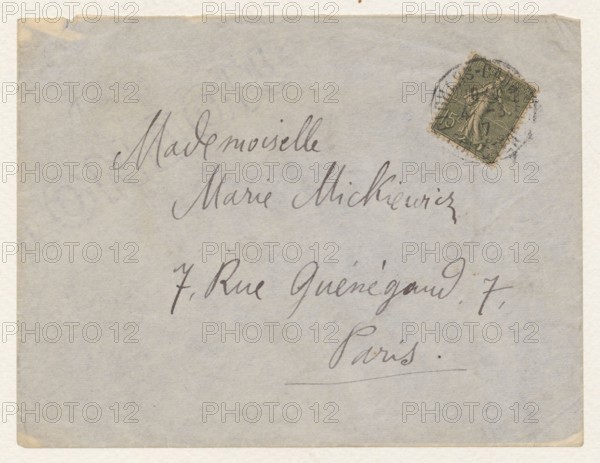 Envelope of a letter to Maria Mickiewiczówna, addressed to Maria Mickiewicz 1868–1952; author: Tadeusz Makowski 1882–1932; dated 4 March 1917, Clohars-Carnoët; envelope containing a manuscript letter; height 11.0 cm, width 14.4 cm., A pale gray envelope with a few creases and slightly worn corners, showing a group of dark gray handwritten strokes across its front, and a small green postage stamp with dark printed details affixed near the upper right, the stamp surrounded by a circular dark cancellation mark; colors visible include pale gray, dark gray, green, dark green, beige, and off-white.