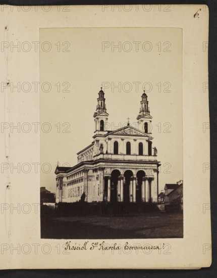 Warsaw. Church of St. Charles Borromeo according to a design by architect Henryk Marconi showing a fragment of the southern frontage on Chlodna Street; photograph by Karol Beyer 1818–1877; dating: 1861–1863; subject: churches; style/genre: nature photography/photograph; photographic print: height 9 cm, width 6.2 cm; support: height 11.3 cm, width 8.8 cm., The image shows a sepia-toned photograph of a large classical-style building with a prominent portico supported by several tall columns, a triangular pediment above the central façade, and two multi-tiered towers rising on either side; the structure appears light-colored against a pale background, with darker shadows at its base and in the foreground, and a few smaller darker buildings flanking it on one side; the surrounding area in front of the building is dark brown to black, while the margins and border around the photograph are cream and off-white.
