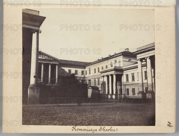 Palace of the Government Commission of Revenue and Treasury of the Kingdom of Poland at Bankowy Square in Warsaw, designed by architect Antonio Corazzi 1792–1877; photograph by Karol Beyer 1818–1877, 1861–1863; photographic print nature photography — image: 7.6 cm high x 8.7 cm wide; mount: 11.3 cm high x 8.8 cm wide., A sepia-toned photograph of a large classical building complex behind a tall iron fence, showing a paved foreground and a group of columns forming porticoes at the front of the structures; the buildings have rectangular windows, decorative cornices, and a triangular pediment with sculptural relief above one entrance, while a few trees or shrubs are visible behind the fence; visible colors include sepia, brown, beige, cream, black, and off-white.