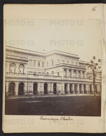 Palace of the Minister of Treasury of the Kingdom of Poland at Bankowy Square, designed by architect Antonio Corazzi; photograph by Karol Beyer 1818–1877, 1861–1863; photography, nature photography; photographic print 8.5 × 8.4 cm, mount 11.3 × 8.8 cm; Warsaw, Rymarska/Bankowy Square., A sepia-toned photograph of a large classical building with a long colonnaded ground floor and arched openings, a balustraded terrace above, and a taller central block with rectangular windows and ornate cornices; the facade shows decorative moldings and several arched windows on the upper level. In front of the building is a dark grassy lawn and a few slender trees with sparse foliage near the right side. The image is bordered by a pale margin and a darker outer edge, and the overall colors visible are sepia brown, cream, and dark brown.