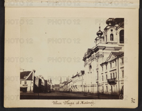 Dluga Street from Miodowa Street View towards Freta Street, Karol Beyer 1818–1877 photographer, 1861–1863, photograph from nature; photographic print: image 7 × 8.8 cm; support 11.4 × 8.8 cm. Depicts Warsaw: Dluga Dluga Street, Freta Freta Street, Pauline Church Freta Street, St. Jacek Church Freta Street, Piarist Church Dluga Street, Holy Trinity Dluga Street, Orthodox churches., A sepia-toned street scene showing a wide street flanked by buildings, with a large ornate building on the right featuring domed towers, decorative facades, arched windows, and a small balcony, and a row of smaller buildings receding into the distance on the left; the sky appears pale, and the foreground street area is darker, with a few indistinct figures and shadows near the buildings. Colors visible include sepia/brown tones, beige, cream, black, and pale off-white.