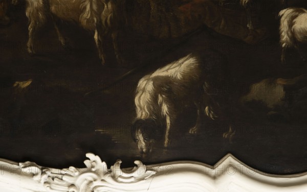 Shepherd's Scene with a Shepherd Milking a Goat, Philipp Peter Roos 1657–1706. The overall tones are browns and dark blues. The surface is fully composed, the focal point is a cow standing at the back and a group of five animals, three sheep and two goats, filling the right side of the scene. On the right, a seated shepherd in a sheepskin coat and hat milks a goat into a wooden bucket. Next to the goat is a small white kid. At the front a dog laps water from a shallow pond. On the right in the background, city buildings are visible on a hill; the dark sky is covered with puffy clouds. In the upper corner is the Temple of the Sibyl in Tivoli. Several identical faces of sheep and rams appear. Philipp Peter Roos, known as Rosa di Tivoli born August 30, 1657 in Sankt Goar; died January 17, 1706 in Rome — German landscape painter. Possibly related works: NB 4918, NB 4920, and NB 4921. 18th century, Italy; overdoor; height 91.0 cm, width 127.0 cm., A dark painting shows a group of animals wi...