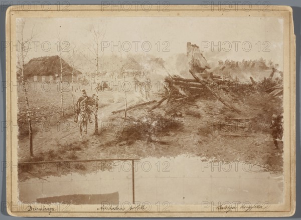 Painting the Raclawice Panorama: fragment of a canvas depicting a hussar riding a horse along the road from the direction of the Dziemierzyce farm. Photograph by Hamel and Feigl Lviv; photographic materials typeset; 1892–ca.1905. Subjects and makers associated: Jan Styka 1858–1925 and Wojciech Kossak 1856–1942. Medium/technique: painting panorama; photographic print glued over entire surface to cardboard backing. Date: 1893–1894. Photograph type: photography from nature; photographic print dimensions: 11.9 cm × 17.1 cm; backing dimensions: 13.5 cm × 18.5 cm., A sepia-toned scene shows an outdoor landscape with a dirt path flanked by thin leafless trees and grassy ground. A mounted figure on horseback wearing darker clothing rides along the path toward the foreground. To the left, there is a thatched-roof structure partially obscured by trees, and a few small figures are scattered near it. The center and right foreground display a jumble of fallen logs and rough earthen ground with a fe...