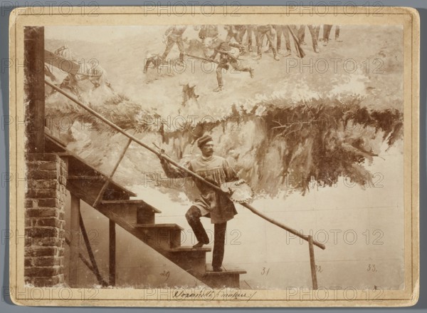 Michal Sozanski standing with a palette on a scaffolding next to a part of the canvas depicting the scene of the escape of Russian artillery vehicles towards Janowiczki, Hamel and Feigl; photograph documenting the painting of the Raclawice Panorama; print glued across the entire surface to a cardboard backing; 1893/1894; Lviv; photographic print: height 11.8 cm, width 17.2 cm; backing: height 13.5 cm, width 18.5 cm., A sepia-toned photograph shows a man standing on wooden stairs holding a long pole and an artist's palette, wearing a loose tunic and a cap, with one foot on a stair and one on a lower step; a brick wall is visible at the left of the stairs and a simple handrail runs alongside them. Behind him is a painted backdrop depicting a rugged landscape with grassy textures and a group of figures and animals at the top edge; the backdrop displays brushy strokes in lighter and darker brown tones. The image has a narrow beige border around it and the overall colors visible are shades ...
