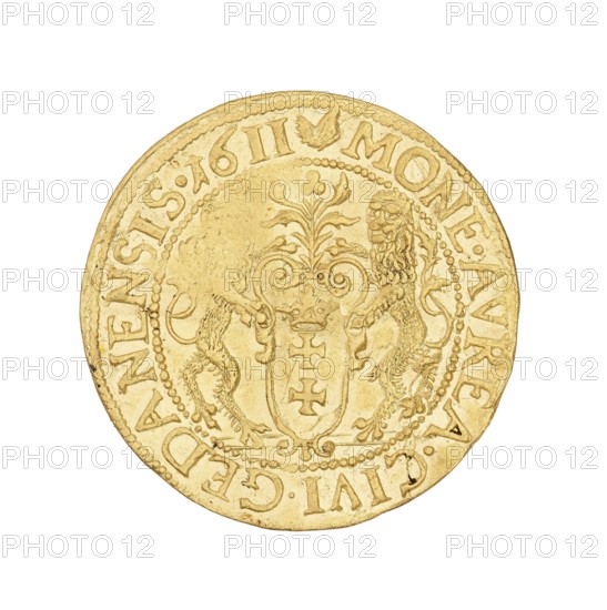 Gdansk ducat; Klüwer, Daniel fl. 1608–1618, mintmaster co-creator; Sigismund III Vasa King of Poland; 1587–1632, issuer; struck in Gdansk, Poland; coin., A round metallic object with a golden color fills most of the image against a white background; the object shows a raised decorative central shield flanked by two stylized lions and topped with a floral or plume-like motif, all in the same golden hue; a dotted circular border surrounds the central design and a band of raised characters follows the outer rim of the object; the surface shows slight scratches and areas of wear with small darker marks and subtle variations in the gold tone.