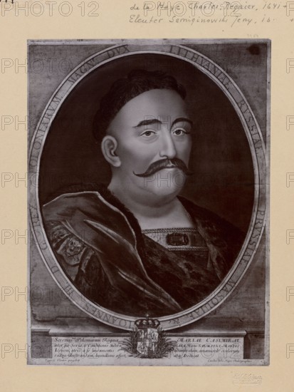 Photograph of a copperplate engraving: Charles de La Haye 1641-post 1712 and Jerzy Siemiginowski-Eleuter ca. 1660-1711, portrait of Jan III Sobieski King of Poland; 1629–1696. Print glued to cardboard photographic studio, before 1915. Photograph of a work of art; photographic print: height 22.5 cm, width 16.5 cm; support: height 35 cm, width 25 cm., portrait, male portrait, Polish personalities, Polish royal dynasties, Jan III Sobieski — iconography; artists: La Haye, Charles de; Siemiginowski-Eleuter, Jerzy; Kraushar, Aleksander; Sztejner, Boleslaw Julian., A sepia-toned portrait of a person shown from the chest up inside an oval frame, with dark hair, a prominent dark mustache, and a calm facial expression; the person wears a heavy dark cloak with textured fur and patterned fabric at the neckline, and a decorative clasp at the chest. The oval frame sits on a lighter rectangular background with a crest or coat of arms centered below the portrait and ornamental elements flanking it. Th...