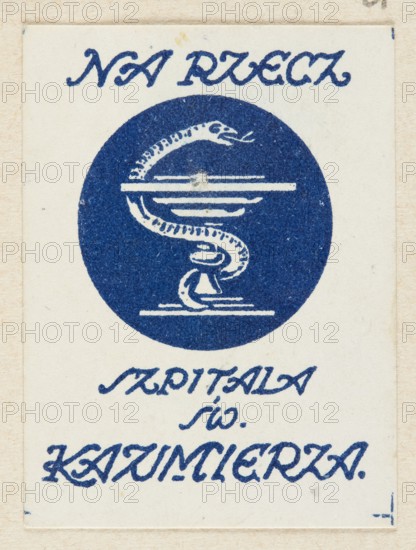 Depicting the chalice of Hygieia and the inscription: FOR THE SUPPORT OF ST. CASIMIER'S HOSPITAL;, charity; Poland; World War 1914–1918; 20th century; charity stamps; health service; Radom Masovian Voivodeship; 1917; Radom; contribution; print; ephemera., A rectangular off-white card with a centered dark blue circular emblem showing a stylized coiled snake around a stand or bowl, the snake and stand rendered in off-white against the blue circle; the card has ornamental dark blue script-like markings above and below the circle, and the paper shows subtle beige aging, small dark specks, and slightly darker border edges.