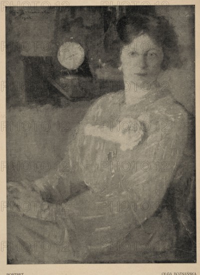 Reproduction of a painting: Olga Boznanska 1865-1940, Portrait; painting, Polish painting, Boznanska, Olga 1865-1940 - reproduction, women, women's portraits, portraits, after 1865, press illustration, reproduction of a work of art, illustration: height 25.9 mm, width 19.0 mm, sheet: height 34.8 mm, width 25.4 mm, A portrait of a seated woman shown from the waist up with a softly lit face turned slightly to one side, wearing a textured dress with a decorative floral element at the chest; the image is monochromatic with shades of gray, black, and beige, showing soft brushwork and a slightly grainy texture; her hair appears dark and styled back, and a round light-toned circular object is visible in the darker background to one side, while the overall composition has muted contrasts and a worn, aged appearance.
