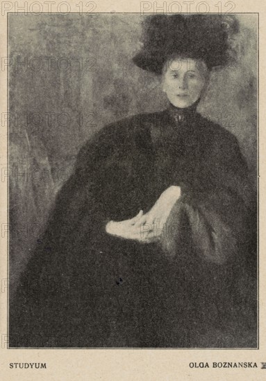 Reproductions of paintings: Olga Boznanska 1865–1940, Study; Portrait; Portrait verso; painting; Polish painting; Boznanska, Olga 1865–1940 – reproduction; female portraits; women; male portraits; sitting women; portraits; 1910; press illustration; reproduction of a work of art, A portrait of a seated person wearing a dark outfit and a large dark hat, shown from the waist up and positioned slightly to one side, with a pale hand resting outward on a dark surface; the background is textured and muted, and the visible colors are shades of black, gray, and beige.