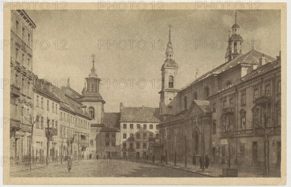 Warsaw. Dluga Street, Bulhak, Jan 1876–1950 photographer, St. Wojciech Printing House and Bookstore Poznan printer, ca. 1930, Warsaw; postcard; 9 cm × 14 cm, A sepia-toned street scene shows a wide paved road flanked by a row of multi-story buildings on each side, including several ornate façades and architectural details, with a group of tall church towers and steeples rising above the rooftops; a few leafless trees line the sidewalks, and a few small figures of people are visible walking near the buildings; the overall colors are shades of brown, tan, and beige.