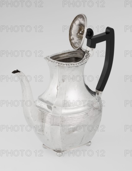 Coffee pot; maker: Harris, CS & Sons London, goldsmiths' firm, active 1817–1933 and Harris, Charles Stuart maker, fl. 1852–1897; provenance: purchased scrap - purchased. Pear-shaped, ribbed coffee vessel supported on four ball-shaped profiled legs; belly decorated with a band of narrow half-cylinders and grooves; godron ornaments; high side spout-shaped handle and a contemporarily added wooden axial handle set in silver sockets; upper edge edged with a godron band; hinged lid domed in the center, topped with a bowling-pin finial. Dated 1895–1896. London, England. Materials/technique: silver with wooden handle; height 21.2 cm, width 18.5 cm, depth 10 cm; weight 640 g., A shiny metal pitcher with a curved spout and an open hinged lid showing the interior, a dark handle attached to the body with a rounded knob near the lid, a rounded body with horizontal decorative ridges and a slightly flared neck edged with a scalloped rim, small rounded feet at the base, and visible scratches and tarni...