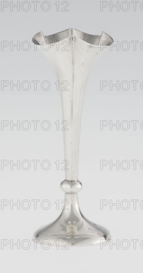 Chalice-shaped vase, maker: Woodward, Horace & Co Ltd Birmingham, London; fl. ca 1851–1919; corporate slogans/goldsmith's firm; purchase provenance; scrap - purchase. Flowers vessel, pearling ornament. Vase supported on a circular foot transitioning into a short stem terminating in a ring, with a goblet in the form of a slender flower calyx; tall, conical, quarter-part at the top edged with pearling. 1899/1900. Great Britain, England, London. Vessel. Height 12.5 cm; width 5.5 cm; depth 5.5 cm; weight 38 g., A tall, narrow vase with a flared, scalloped rim and a long tapered stem ending in a rounded knob above a bell-shaped base, all surfaces smooth and reflective, showing shades of silver and light gray with small darker gray marks and faint scratches, set against a plain light gray to off-white background.