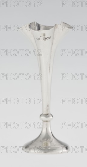 Chalice-shaped vase, Woodward, Horace & Co Ltd Birmingham, London; fl. ca. 1851–1919 maker, scrap - purchase, flowers vessel, pearling ornament. Vase supported on a circular foot, transitioning into a short stem terminating in a ring, with a goblet in the form of a slender flower calyx; tall, conical, quarter-part at the top, edged with pearling. 1899/1900. Great Britain, England, London. Vessel. Height 12.5 cm; width 5.5 cm; depth 5.5 cm; weight 38 g., A tall, slender metal vase with a flared, scalloped rim sits on a rounded stem and bell-shaped base, all rendered in a reflective silver color; the surface shows a few areas of tarnish and small scratches, and the rim has a subtle beaded edge.