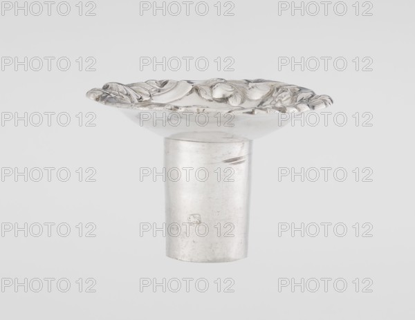 Single-candle candlestick by William Cafe fl. 1757–ca.1802, rococo, 1763–1764, England London, Great Britain. Rococo single-candle candlestick on a raised domed foot with a hexagonal rim, decorated with flower heads at the corners, passing into a baluster shaft and terminating in a vase-shaped socket with a disc-shaped drip pan. Decorated with rococo motifs in the George II style—rocailles, plant tendrils, flowers, cartouches, shells and acanthus leaves; the entire decoration is slightly spirally twisted. Materials/technique: scrap silver. Function: lighting. Height 29 cm; diameter 16.9 cm; weight 717 g.