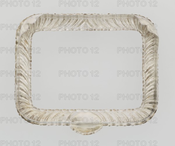 Dressing mirror frame, Comyns & Sons London; goldsmiths; fl. 1859–1953 maker; scrap; clasp; medallion ornament; rectangular mirror frame with rounded corners decorated with oblique clasp and oval medallion; 1890–1891; England, London; dressing accessory; frame; height 15.7 cm; width 13.2 cm; depth 2 cm; weight 102 g, A rectangular ornate frame with rounded corners and a decorative carved pattern along its edges, shown against a neutral background; the frame appears translucent with a pearly off-white and pale beige coloration, with subtle variations of cream and light gray tones and small areas of slightly darker beige.