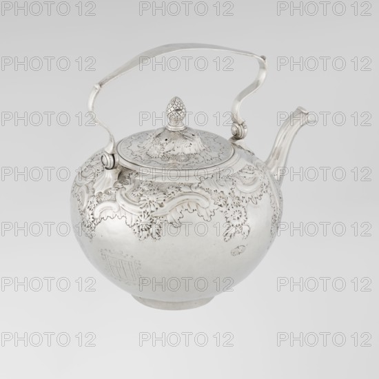 Buliera kettle for boiling water, maker: Benjamin Gignac fl. 1745–1774, goldsmith. Rococo rocaille style with repoussé rococo decoration and floral/plant ornament. Spherical buliera with a flat bow mounted on volutes; side spout; centrally arched cover topped with a pine cone. Decorated with two engraved coats of arms — one four-field in an oval beneath a baronial crown, the second in an illegible shield. Missing base with heater. Date: 1753/1754, London, England, Great Britain. Vessel. Height 22 cm, width 24 cm, depth 19 cm, weight 848 g., A polished metallic teapot with a rounded body, ornate raised floral and scrollwork decoration along the upper portion, a hinged domed lid topped with a textured finial shaped like a small pinecone, a curved spout, and a hinged arched handle attached at two points; visible colors include silver tones and subtle variations of gray against a pale gray background.