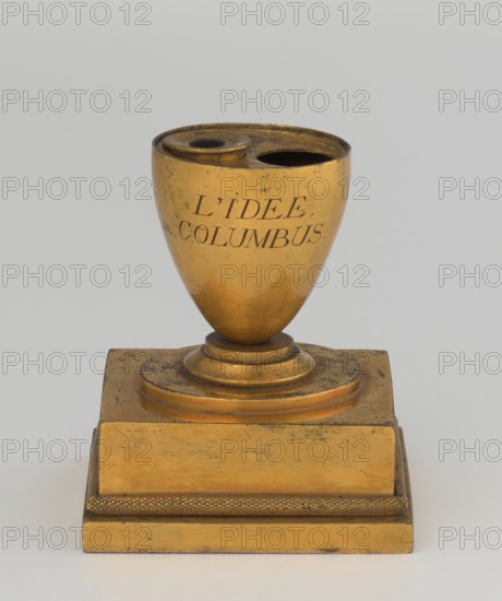 Inkwell, creator, attributed author: Bylewski, Tadeusz 1866–1939; early 19th century, France, inkwell; dimensions: height 13.5 cm, width 9.4 cm, depth 8.4 cm, A gilded metal object shaped like an egg-shaped cup atop a tiered square base, with a round recessed area and a smaller raised circular opening at the top; the surface shows worn spots and darkened marks and the metal appears gold in color with areas of darker tarnish, set against a pale gray background.