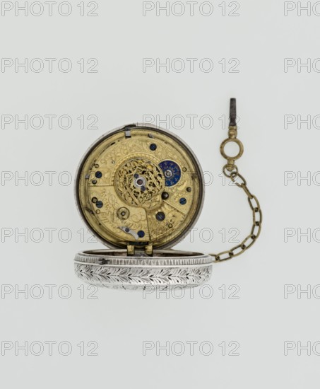 Pocket watch with key. Maker: Eardley Norton born 1728, died 1792, watchmaker; casemaker: APD Germany, 3rd quarter of the 18th century. Pocket repeater in two silver cases: smooth outer case and inner case with framed glazed lid. Mechanism cover engraved with an openwork floral acanthus twig, with winding hole and bell. White enameled dial with black Roman hour numerals, minute scale marked with dashes, calendar with Arabic numerals, three steel hands hour and minute in openwork weave; third straight hand indicating days of month. Small seconds subdial with Arabic numerals at bottom. Dial signed EARDLEY NORTON / LONDON. Movement: gilded brass with circular plates connected by pillars; spring-driven with spindle escapement. Lower plate with openwork crown richly decorated with acanthus tendrils and engraved acanthus volutes; cut-out reserve bears engraved signature Eardley / Norton London. Preserved winding key on a chain. Date: 3rd quarter of the 18th century. Places: case Germany; mak...