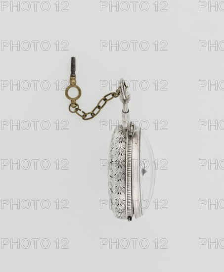 Pocket watch with key, maker: Norton, Eardley fl. 1770–1792 born 1728, died 1792. Casemaker: APD Germany; fl. 3rd quarter of the 18th century. Pocket repeater in two silver cases: smooth outer case and inner case with framed glazed lid; mechanism cover engraved with an openwork floral twig, winding hole, and bell. White enameled dial with black Roman numerals, minute scale marked with dashes, calendar with Arabic numerals, three steel hands hour and minute in openwork weave; straight hand for date. Small seconds subdial with Arabic numerals. Dial signed EARDLEY NORTON / LONDON. Movement: gilded brass with circular plates joined by pillars, spring-driven, spindle escapement; lower plate with openwork crown richly decorated with acanthus tendrils and engraved acanthus volutes; cut-out reserve engraved Eardley / Norton London. Preserved winding key on a chain. 3rd quarter of the 18th century. Case: Germany; movement/attribution: London. Timepiece. Height 8 cm; width 6.2 cm; dial diameter ...