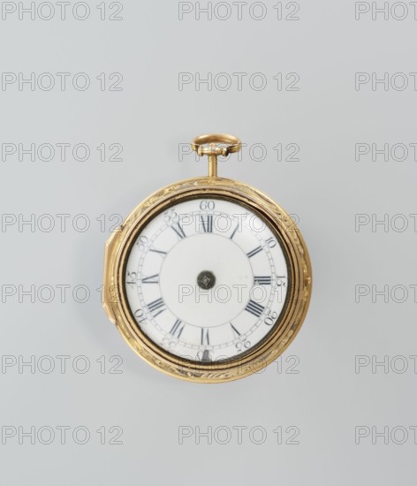 Pocket watch in case; maker: M. Cradelle fl. ca. 1750; watchmaker. Mythological scenes, rococo style. Watch in double case; outer case covered with lizard, with riveted rosette. Mid-18th century, London, England, Great Britain. Timepiece. Height 6 cm; width 4.5 cm; diameter dial 3.5 cm., A round pocket watch with a gold-colored metal case and decorative edge sits against a pale gray background; the watch face is white with a central circular area and an outer ring marked by dark hour indicators shaped like lines and small triangular marks, and a small dark circular winding post at the center; the winding crown at the top is gold-colored and attached to a short stem; the image shows a few subtle shadows beneath the watch and the colors visible include gold, white, dark gray, and pale gray.