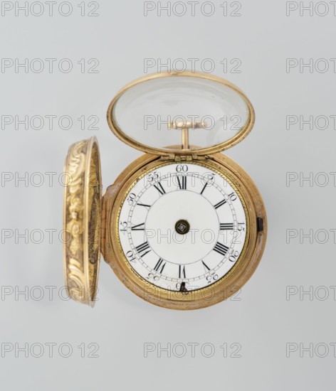 Pocket watch in case; maker: Cradelle, M. fl. ca. 1750; role: watchmaker; decoration: mythological scenes; style: rococo; type: watch in double case with outer case covered with lizard, with riveted rosette; date: mid-18th century; place of origin: London, England, Great Britain; object type: timepiece; dimensions: height 6 cm, width 4.5 cm, diameter dial 3.5 cm., A circular pocket watch with an open ornate cover and open glass lid sits against a pale gray background, the watch case and cover showing a gold color with decorative embossed patterns on the inner rim of the cover, the inner face of the watch being white with concentric circular designs and black radial markings, and small dark metallic components at the center and edge; overall visible colors include gold, white, black, dark metallic, and pale gray.