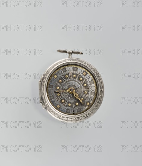 Pocket watch by Joseph Zeidlmayr active first half of the 18th century. Watch in a double case; outer case with a framed dial and a repoussé depiction of the Crucifixion with Mary and St. John on the back, surrounded by a border of eight C-shaped sections and additional ornamental decoration. Smooth silver inner case. Silver dial with Roman numerals for hours separated by gold dots and Arabic minute numerals. The reserve bears the signature of the watchmaker Zeidlmayr. Inside, the movement cover has a cutout revealing a bun. The movement is marked: Breslau / Joseph Zeidlmayr. Inside the case: a negative MS mark, a negative mark and a possibly illegible goldsmith’s mark rosette?, and two numbers—markings likely made by repair watchmakers. 1st half of the 18th century; Wroclaw, Silesia. Timepiece., A circular metal pocket watch with an ornate outer case in silver tones and a decorative winding crown, showing an inner dial with a darker metallic face, several small raised gold-colored stu...