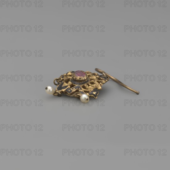 Earring; maker, Renaissance style; 19th century; Poland; jewelry; height 3.5 cm; weight 7 g, A small ornamental object lies on a smooth gray surface; it is made of a gold-colored metal with an intricate openwork design and a central faceted stone that appears pinkish-red, and there are a few small round creamy white pearls attached, along with a slender gold-colored bar-like piece extending from the main ornament.