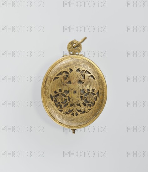 Pectoral watch, maker: I. Stosch fl. 1st half of 17th century. Baroque, 17th century mechanism dated 1st half of 19th century. Oval case with frame and circular glazed cut-out revealing a dial with a silver ring and hour numerals. Frame engraved with a tendril; underside open-work with a winged bust merging into a tendril and surrounding tendril motif. Openwork sides with tendril ornament, floral and grotesque decoration. Mechanism with striking device, signed I. STOSCH. Timepiece; height 5.3 cm, width 3.5 cm. Place of origin: Wroclaw., A circular metal object with a warm gold color hangs against a pale gray background; the front surface is decorated with ornate openwork showing a symmetrical winged figure surrounded by scrolling foliage and floral motifs, all rendered in the same gold tone with darker recessed areas visible through the cutouts; a small round loop and ring at the top, also gold, attach to the piece, and a tiny decorative finial projects from the bottom, while the surro...