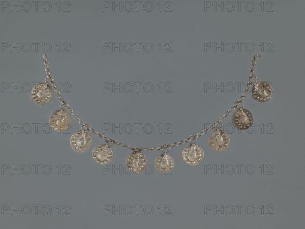 Bracelet, early 20th century, Middle East; Islamic art; shells; body ornament; female hand ornament; fashion accessory; geometric ornament; jewelry; length 27.0 cm, A delicate chain with a group of small round dangling discs is displayed against a gray background; the chain and discs appear metallic and silver in color, with each disc showing a textured surface and raised decorative elements, and the arrangement forms a gentle curved line across the image.