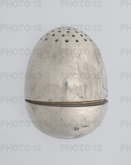 Salt cellar, scrap - purchase; spices vessel, salt vessel, spice vessels; 19th century; St. Petersburg, Russia; vessel; height 4 cm, width 3.1 cm, A metallic, egg-shaped object with a top half featuring a pattern of small circular holes and a bottom half separated by a thin band, both halves showing surface scratches and scuffs; visible colors include silver and hints of gray and muted gold on the thin separating band, set against a pale gray background.