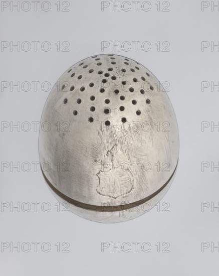 Salt cellar, scrap - purchase, spices vessel, salt vessel, spice vessels, 19th century, St. Petersburg, Russia, vessel, height 4 cm, width 3.1 cm, A rounded metallic object with a dull silver-gray surface sits against a light gray background, showing a pattern of several circular perforations on its top and a visible seam around its middle; the metal displays numerous scratches and scuff marks and a faint engraved outline on one side, with darker gray shadows around some holes and along the seam.