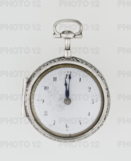 Pocket watch by Carl Willougby, 2nd quarter of the 18th century, London, England. Silver case, partially openwork, richly engraved over the entire surface with acanthus twig and flowers, acanthus scrolls, fish-scale ornament, shells, birds, and two masks male and female. Central circular reserve of acanthus twig, volutes and fish scales enclosing a bell. Glazed lid set in an openwork frame decorated with a floral twig and a broken ribbon. Mechanism between two circular plates supported by columns, with spindle escapement, a worm with chain, and a balance drum; pocket watch with striking function. Gilded openwork crown engraved with an acanthus twig, combined with an openwork foot and a woman's mask. White enameled dial edged with a gilded knurled ribbon, hour markers in Arabic numerals, minutes as vertical lines; steel hands. Height 8 cm, width 5.5 cm, dial diameter 4.5 cm., A round pocket watch with a silver metal case and ornate edge sits against a pale gray background, showing a whi...