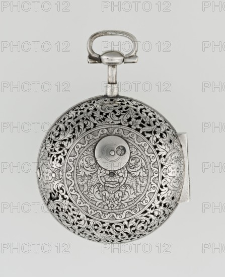 Pocket watch, maker: Willougby, Carl; openwork case; repossession provenance; acanthus scrolls, fish scale ornament, shells, birds, masks male and female as decorative motifs; openwork mechanism decorations. Pocket watch with striking function, silver in a partially openwork case, richly decorated with engraved ornament covering the entire surface of acanthus twig and flowers, among which birds and two masks. In the centre a circular reserve made of acanthus twig, volutes and fish scales, inside a bell. Glazed lid enclosed by an openwork frame decorated with a floral twig and a broken ribbon. Mechanism between two circular plates supported by columns, with a verge escapement, a worm with a chain, and a balance drum. Gilded, openwork crown with an engraved acanthus twig, combined with an openwork foot and a woman's mask. White-enameled dial edged with a gilded, knurled ribbon, hour markers in Arabic numerals, minutes marked with vertical lines; steel hands. 2nd quarter of the 18th centu...