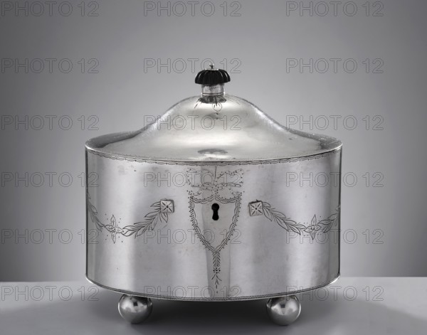Classicist sugar bowl by Christian Jacob Haase fl. 1797–1810, Late Classicist style. Oval sugar bowl with a centrally arched hinged lid topped by a wooden knobbed dome; front features a keyhole set in a dot-engraved cartouche from which festoons of lanceolate leaves extend. Maker likely from the youngest generation of the Haase family—Christian Jacob, son of Johann Jakob Haase II; became master in 1797 and left Gdansk with his family in 1810. The HAASE namemark, stamped in a rectangle with rounded corners on this bowl, may be attributable to him though it differs from his father’s mark. Materials/subject: sugar vessel with festoon ornament, classicism. Date: 1799. Place: Gdansk, Royal Prussia Poland. Dimensions: height 13.7 cm, width 15 cm, depth 11.5 cm; weight 540 g., A rounded metallic container with a domed lid and a small dark knob on top sits on a flat surface; the container is silver in color with engraved decorative garlands and floral motifs along its curved sides, a keyhole-s...
