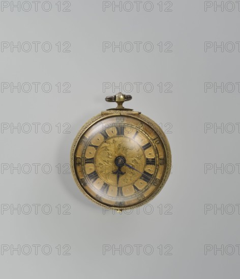 Pocket watch by Jacques Marcet fl. ca. 1725–ca. 1750, gilded silver, almost spherical, double case; enameled numerals on the dial. Cases decorated with plant motifs: inner case with flowers in a vase in a reserve formed by a ribbon that on the outer side forms heart-shaped loops with floral sprigs between them; a strip of plant-floral tendrils on the case side. Outer case with a flower sprig in a circular central reserve surrounded by an interwoven ribbon and floral sprigs in the fields. Movement with an openwork bow and Jacques/Marcet signature. Inside both cases the number E. 4 unidentified. Engraved case decoration stylized in a Middle Eastern manner—possibly intended for the Turkish market. No firm information about the watchmaker; he may have worked in England if a Huguenot. 2nd quarter of the 18th century; possibly France. Timepiece; H 6.5 cm, W 5.5 cm, D 4 cm., A round pocket watch sits against a light gray background, its metal case showing a tarnished gold color with darker pa...