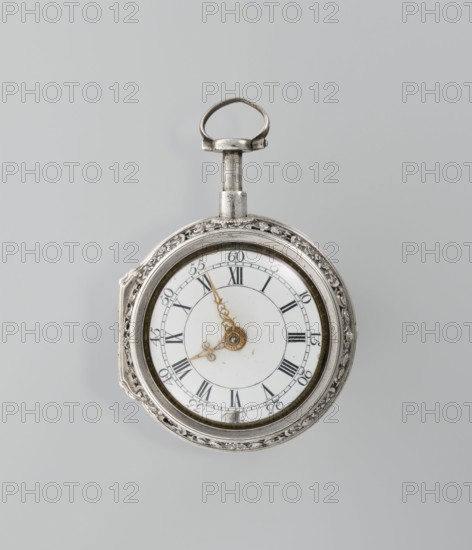 Pocket watch by Shart signed on the movement: Shart / London, c. 1730s, London, England. Pocket watch in a double silver case; inner case openwork with Regency motifs; outer case repoussé depicting Diana hunting, surrounded by an openwork border with male and female busts. White enamel dial with Roman numerals for hours and Arabic minutes, openwork hands. Timepiece. Height 6.8 cm, width 4.8 cm., A round pocket watch with an ornate metal case sits against a light gray background; the case is silver in color with decorative engraved patterns around its edge and a small looped crown at the top. The watch face is white with a central circular area and delicate, ornate hands in a gold color. The watch shows a glass cover surrounded by a thin, darker metal ring and the overall palette includes silver, white, gold, and light gray.