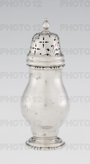 Powdered sugar bowl, pear-shaped on a circular profiled foot, with a domed openwork cover topped with a bowl. Edge of the foot and the top rim decorated with astargal. Openwork; sugar vessel; astargal ornament. Dish. Maker: Burbidge, Richard 1847–1917, goldsmith. Date: 1913/1914. Materials/technique implied: silver openwork. Dimensions: height 15 cm; diameter 5.9 cm; weight 152 g. Place: London, England., A metallic, reflective container with a rounded body and a narrower neck topped by a lid with a finial, the lid showing decorative pierced patterns, all shown against a plain light gray background; visible colors include silver tones and shades of gray.