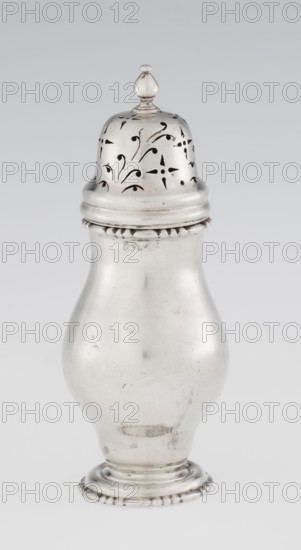 Powdered sugar bowl, powdered sugar bowl pear-shaped with domed openwork cover topped with a bowl; openwork, astargal ornament. Maker: Burbidge, Richard 1847–1917, goldsmith. Seller: Harrod's Stores Ltd London. Function: sugar vessel. Materials/form: dish, pear-shaped powdered sugar bowl on a circular profiled foot. Date: 1913/1914. Place: London, England, Great Britain. Dimensions: height 15 cm, diameter 5.9 cm, weight 152 g., A metallic, bulbous container with a rounded base and a narrower neck topped by a domed removable lid that has a small finial; the lid features decorative cutout patterns in flowing, curved shapes. The body and lid are shiny silver in color with areas of subtle tarnish and small surface scratches, and the base has a ridged decorative edge. The background is a smooth, light gray.