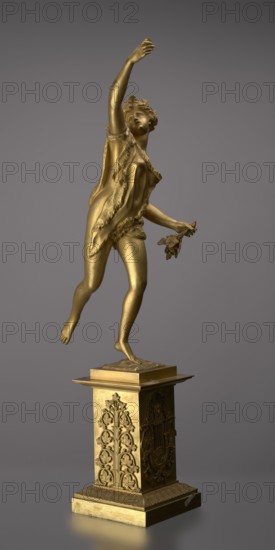 Candlestick, lyre and swans iconography, 19th century, Paris, France, lighting, height 54 cm, A gold-colored metallic statue of a female figure posed on one foot atop an ornate rectangular pedestal, the figure reaching upward with one arm and holding a small bunch of leaves or flowers in the other hand, draped in a textured garment that falls over one shoulder and around the torso, with detailed hair and a turned face, the pedestal decorated with carved botanical and ornamental reliefs and set against a smooth neutral gray background with tones of darker and lighter gray.